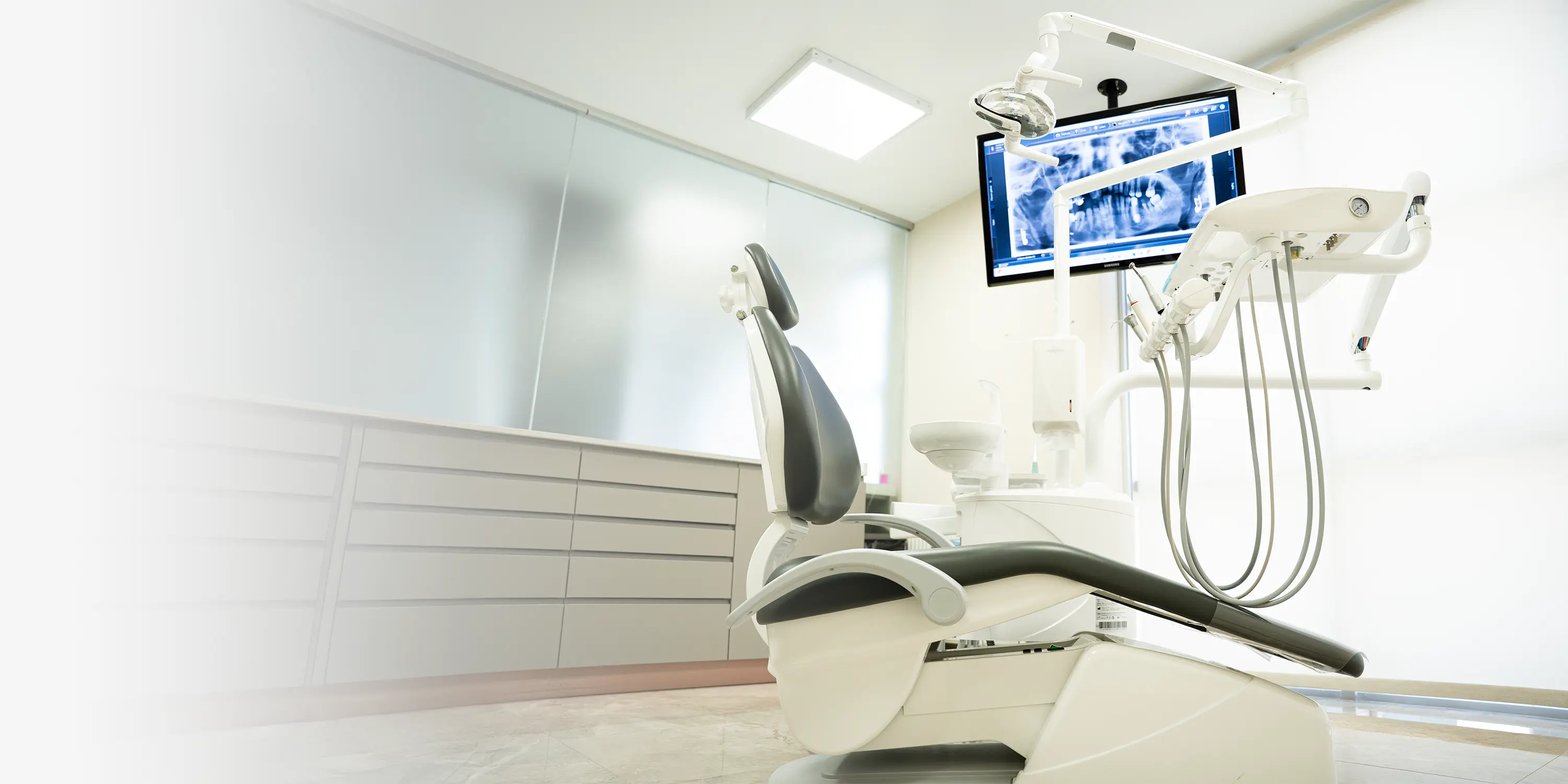 DentVisit treatment room — modern dental unit and digital imaging screen